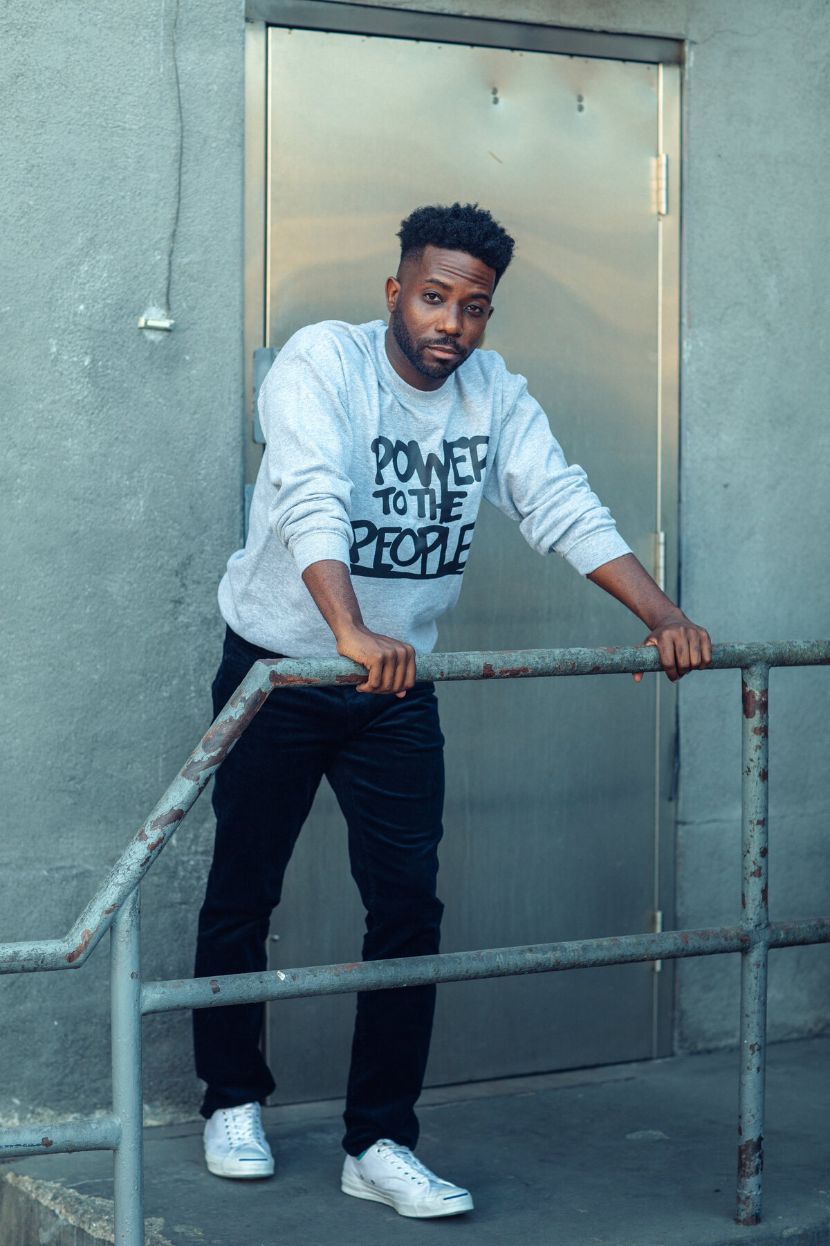 Portrait Photo Of Young Black Man Leaning On Railings Los Angeles