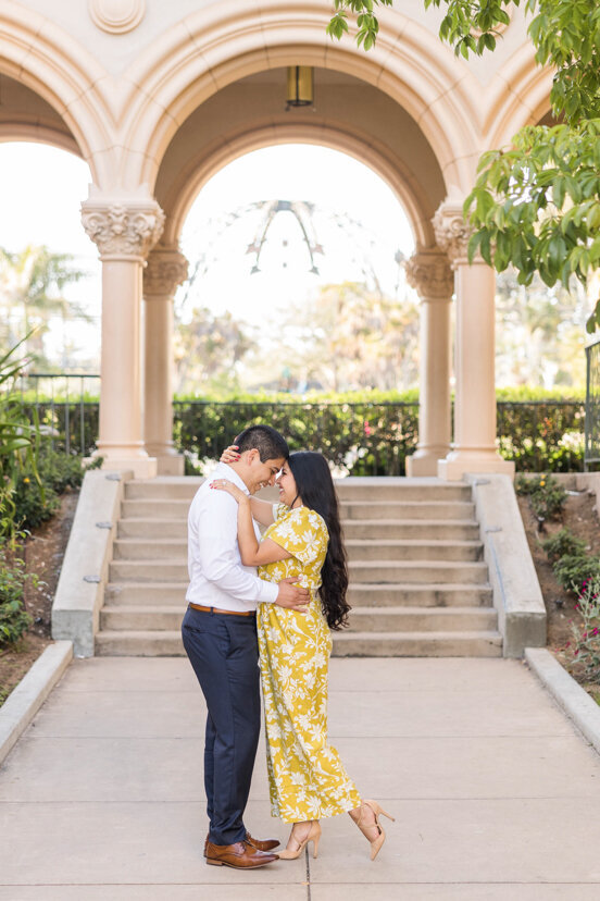 engaged couple by the prado balboa park