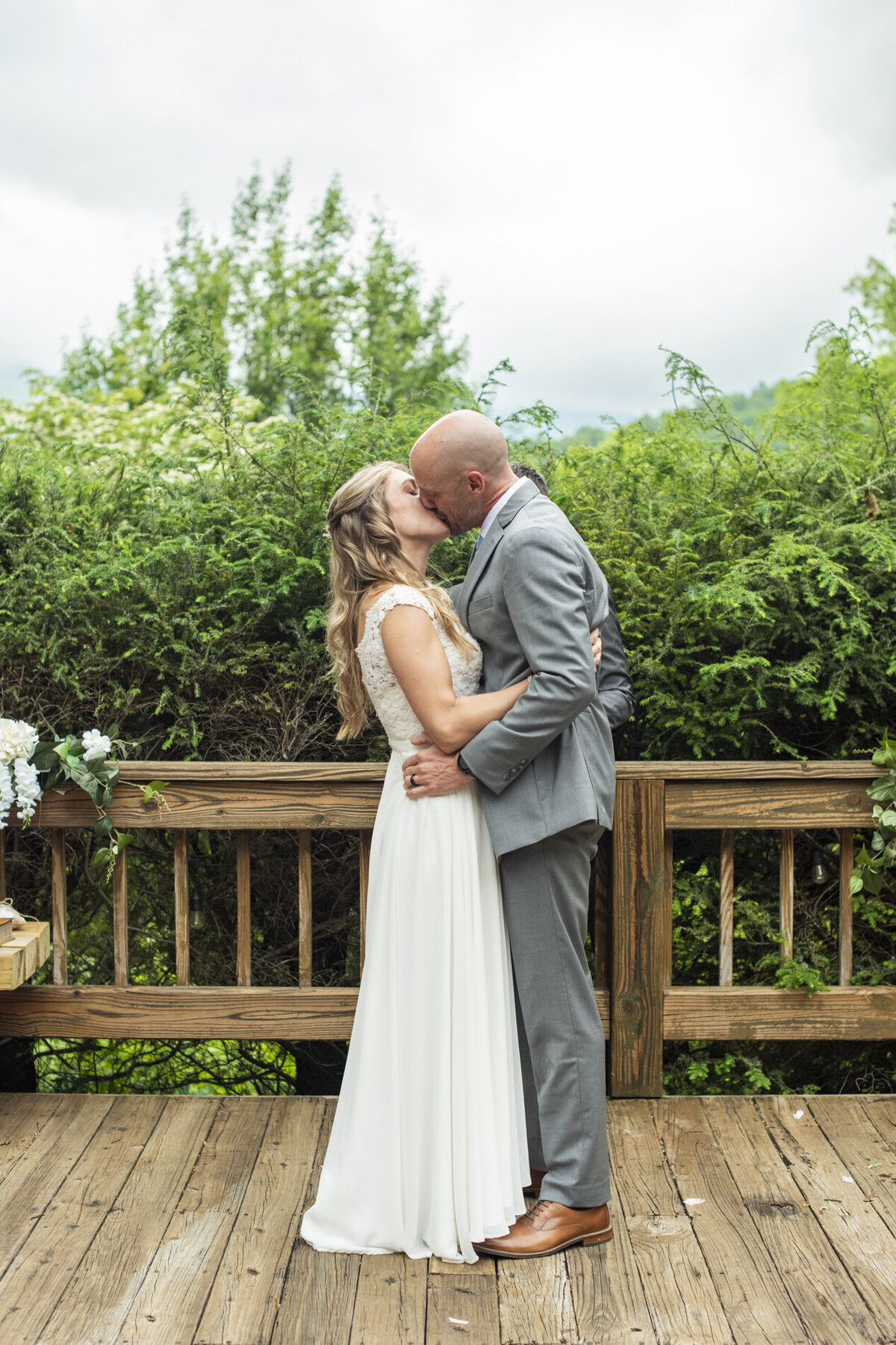 First kiss during wedding at Mount Mitchell Eco Retreat