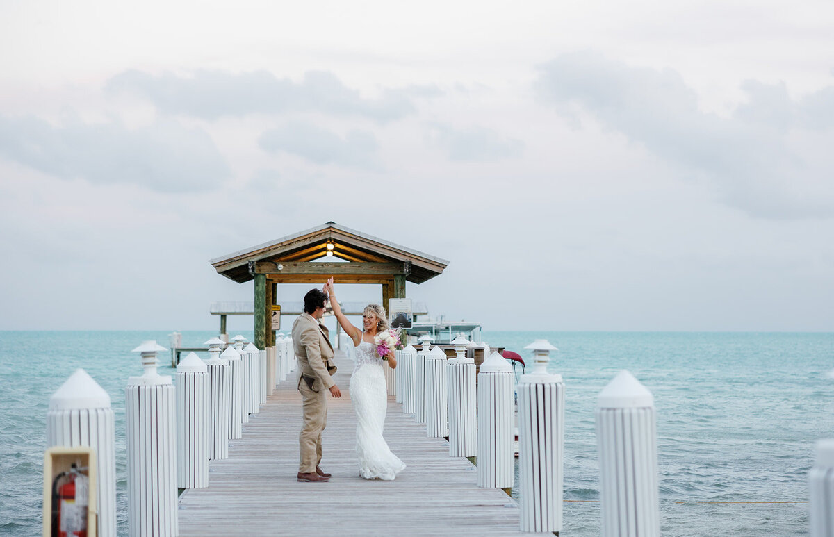 Brenda & Stephen sharing a romantic stroll on the Cheeca Lodge pier after their wedding.