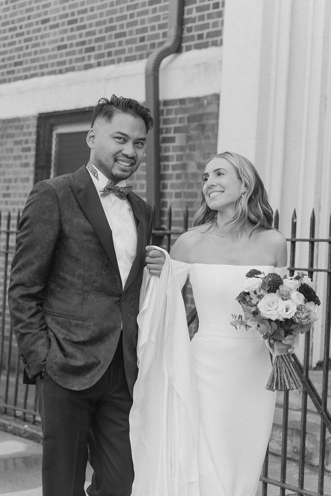 black and white portrait of a bride and groom on brooklyn streets