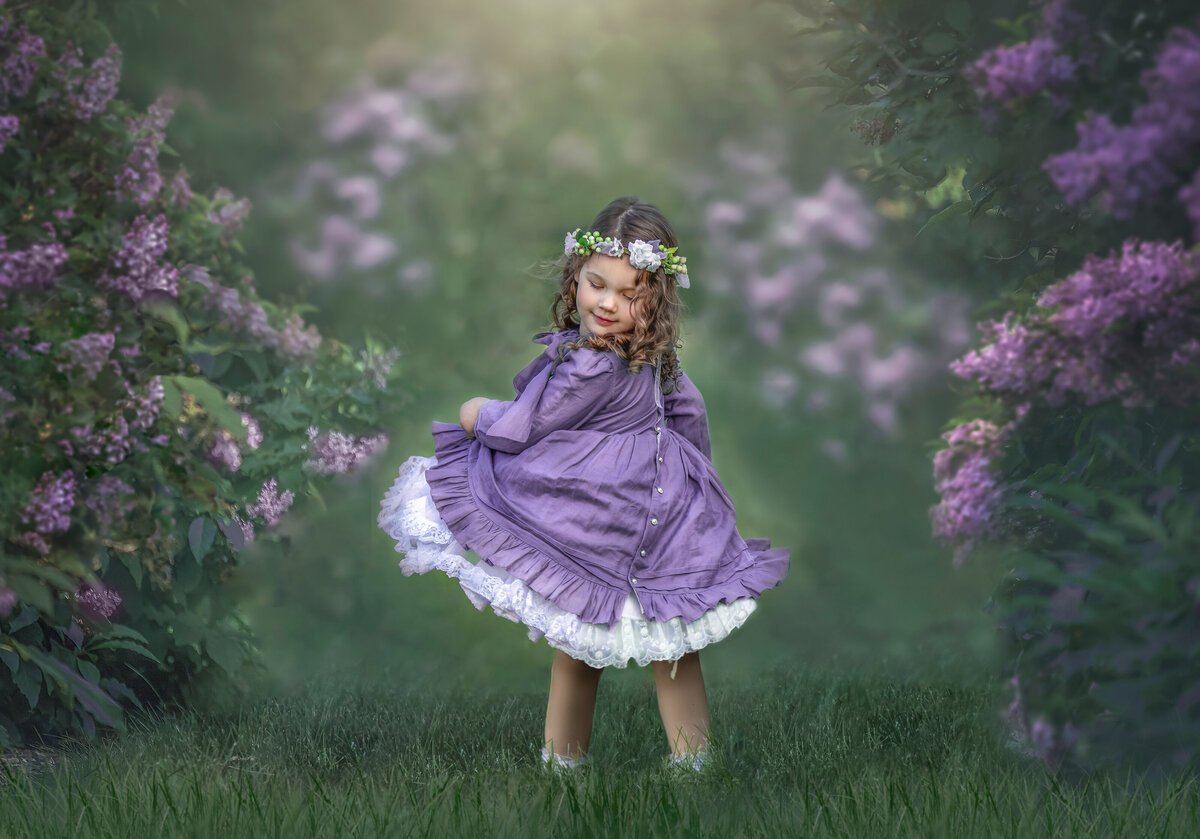 Outdoor little girl photography session in the lilacs