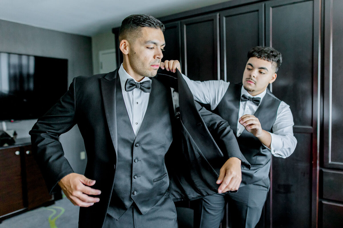 Groomsmen getting ready in tuxedos