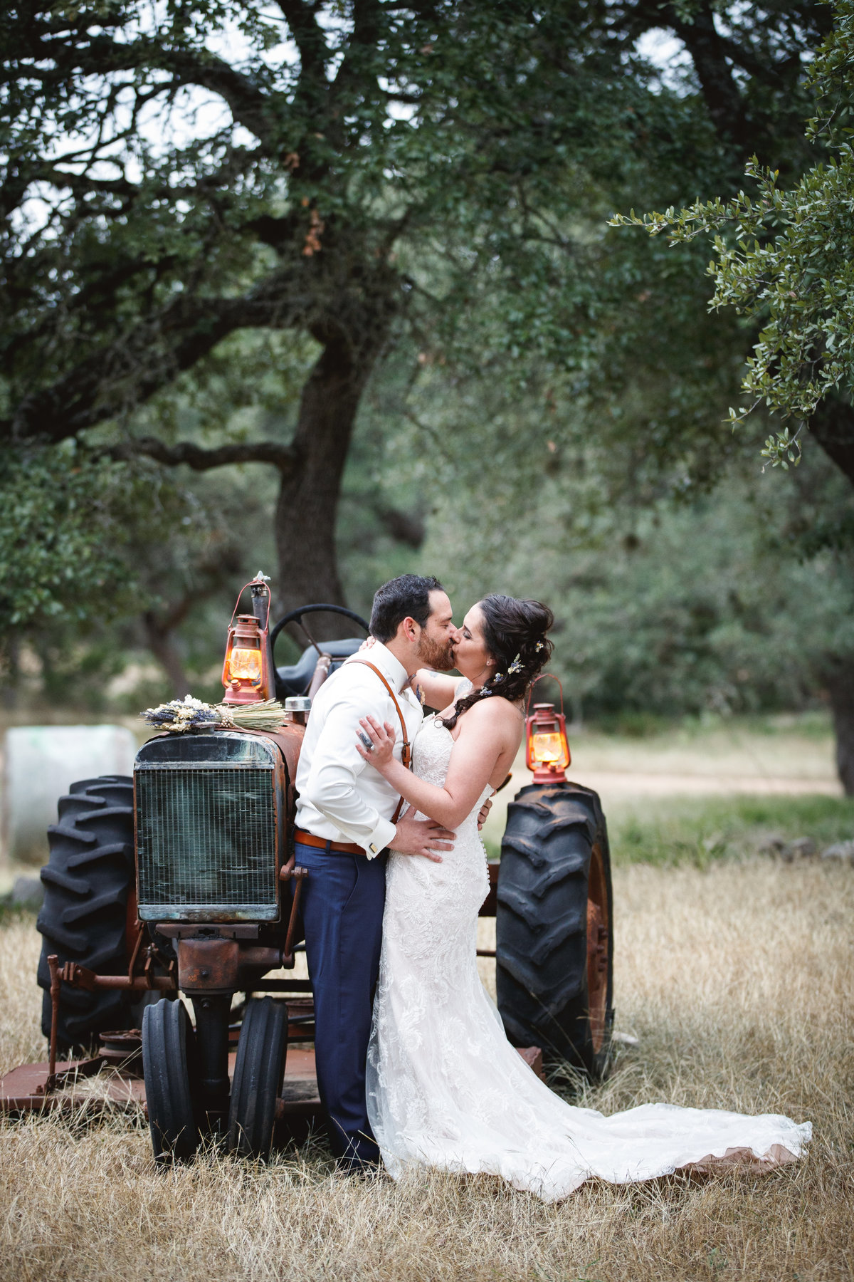 destination wedding photographer bride groom tractor kiss romantic natural light Austin, TX