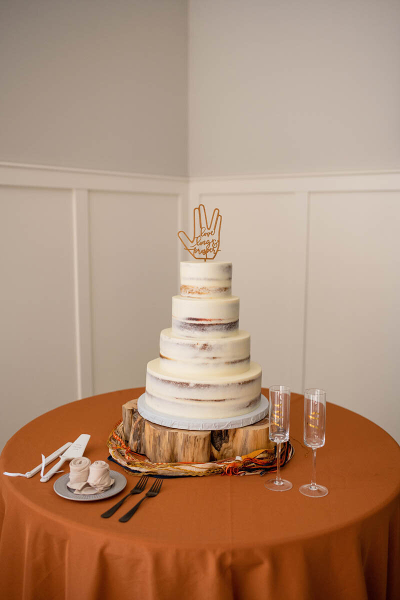Live long and prosper autumn wedding cake on ochre-colored table cloth