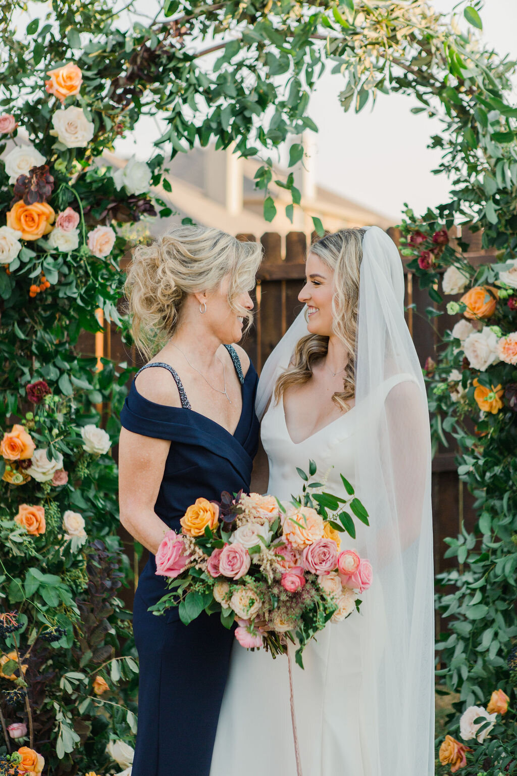 Mother of the Bride and Bride at Floral Arch Ceremony by Vella Nest Floral Design