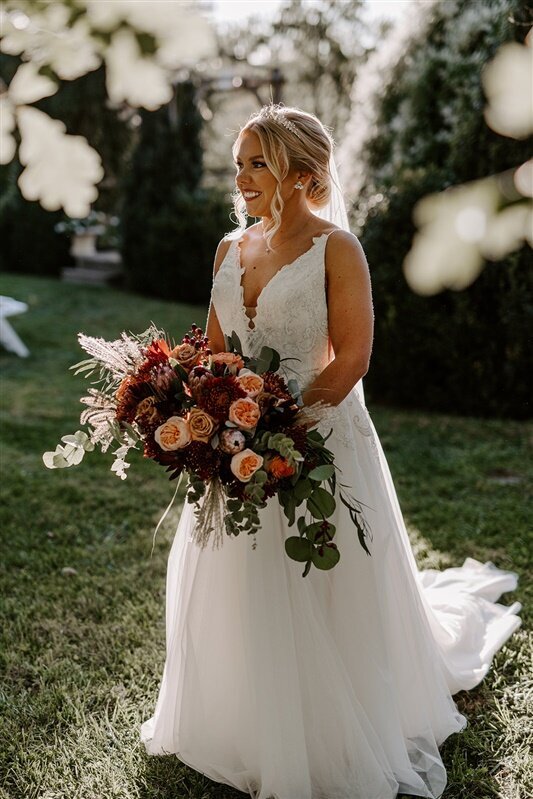 Bride holding large bridal bouquet