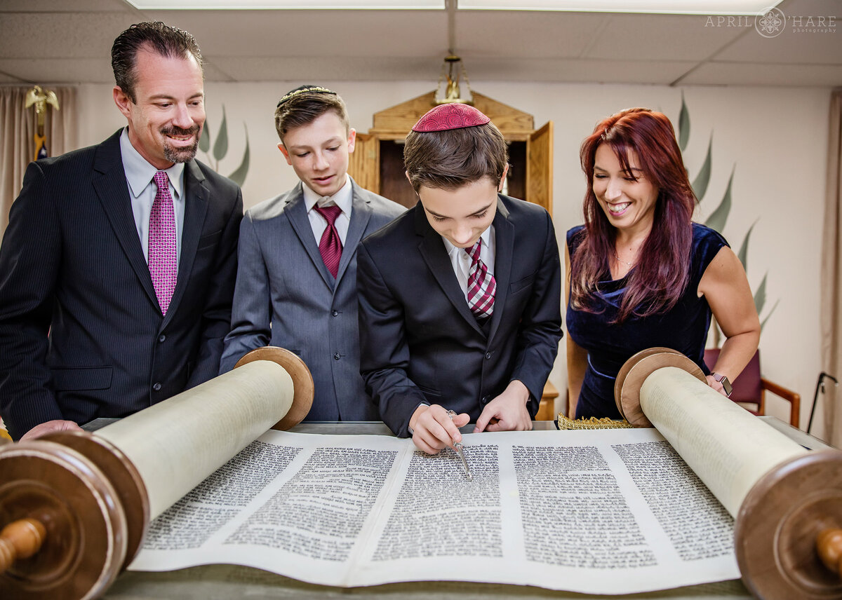 Reading from the Torah surrounded by Family at Denver Bar Mitzvah