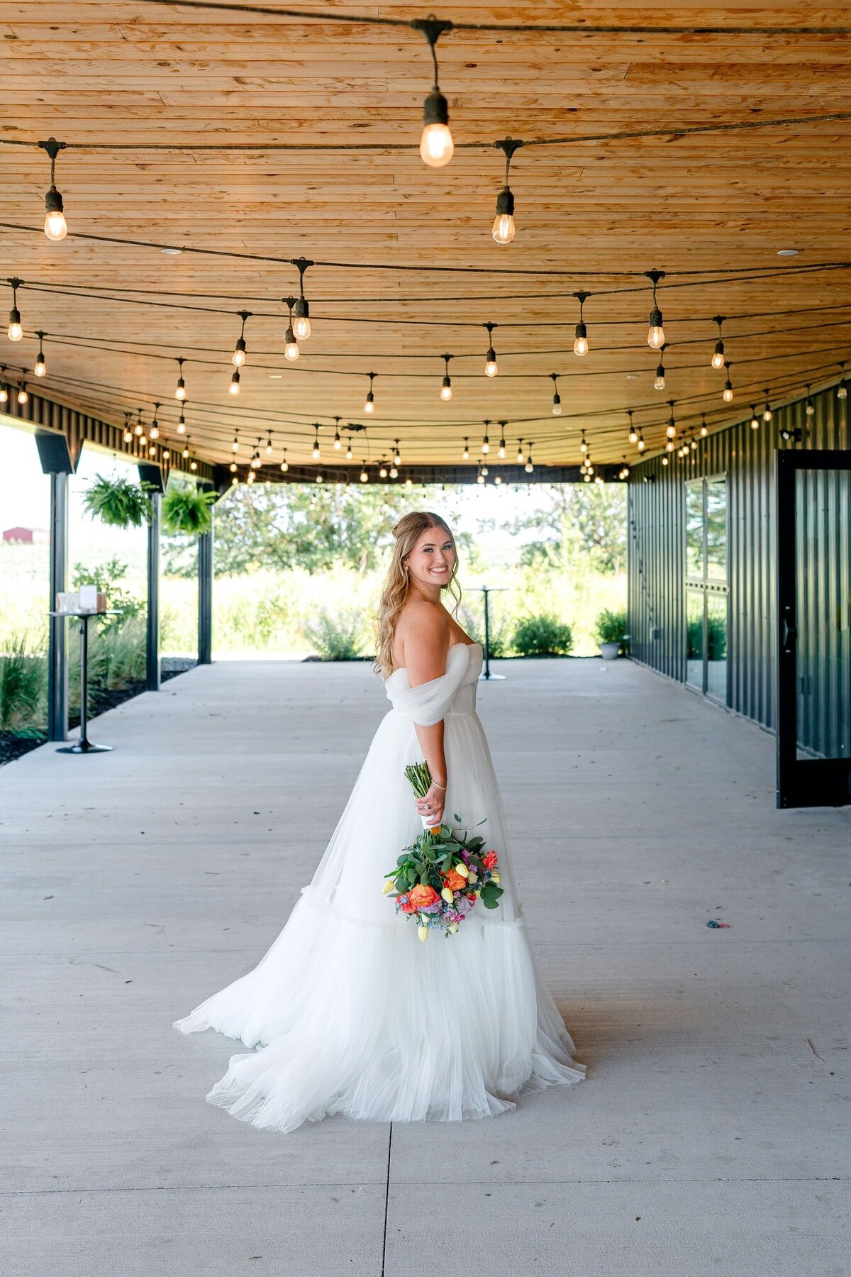 bride-smiling-solo-barn-portrait