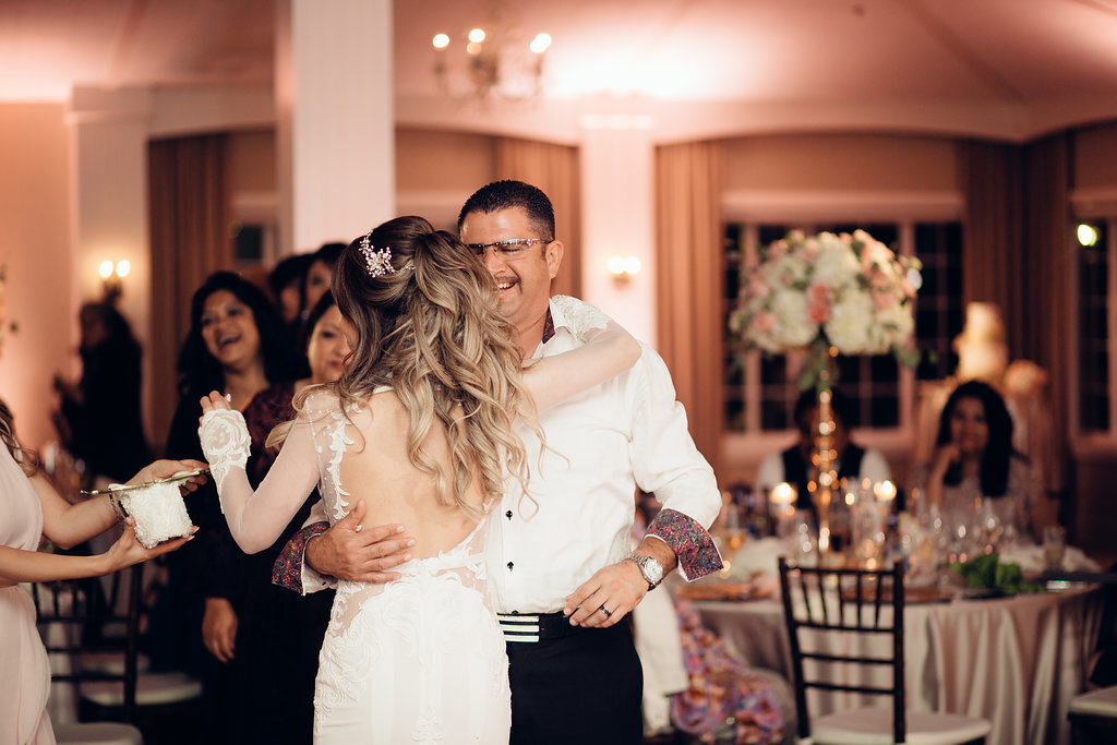 Wedding Photograph Of Bride Dancing With a Man In White Long Sleeves Los Angeles