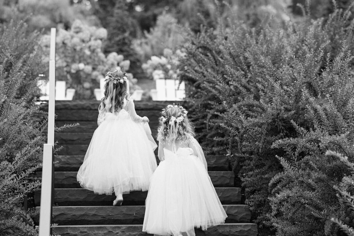 Flower girls walking up the steps