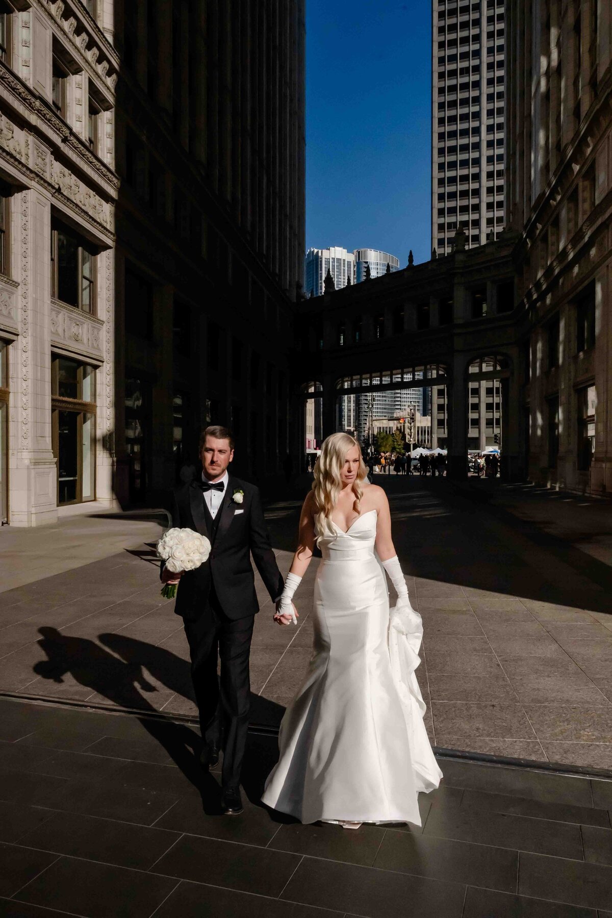 Bride and groom high contrast sun at the Wrigley Building