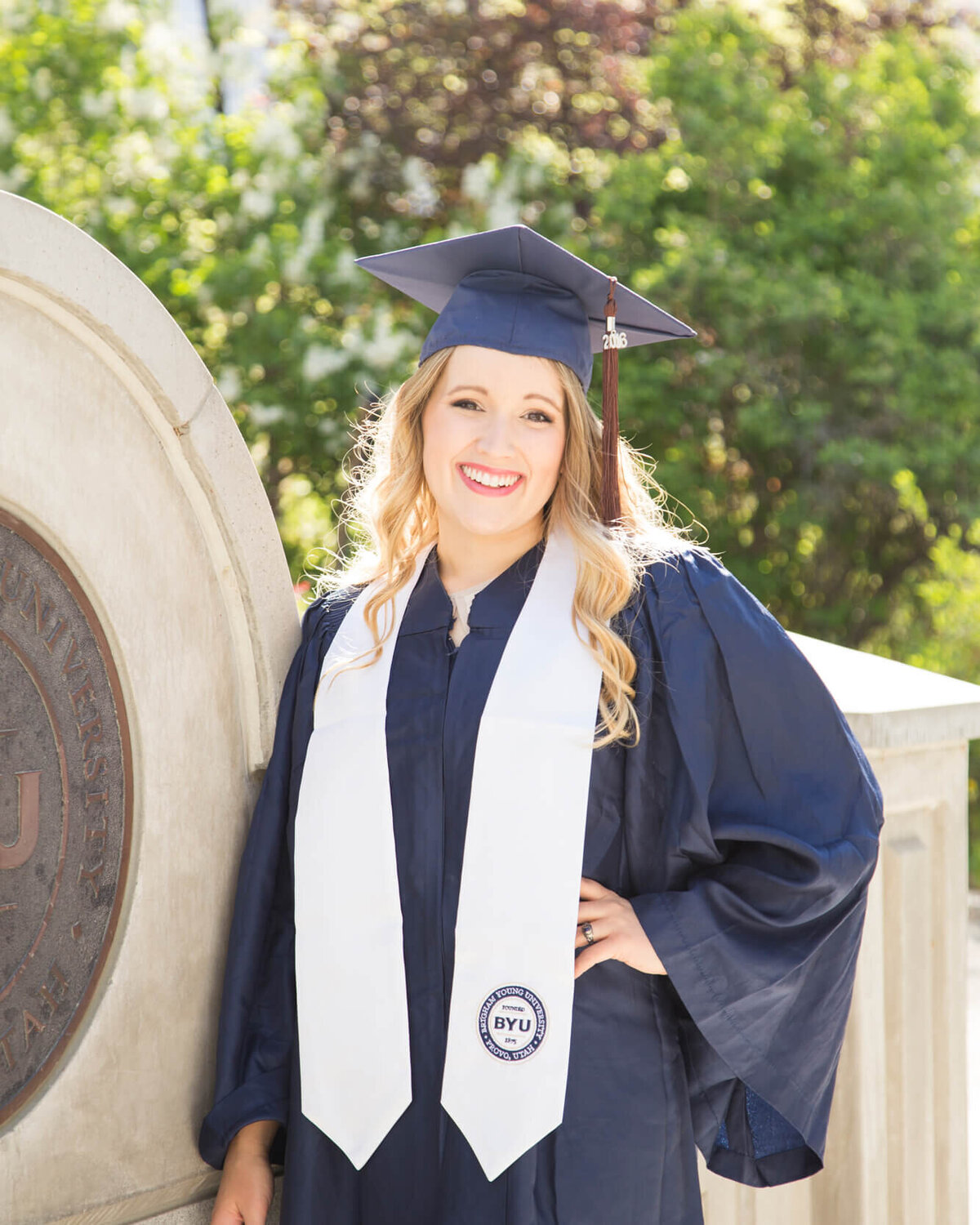 Las Vegas photographer Jessica Bowles,  posing for a portrait  as a BYU graduate with a Bachelor of Fine Arts in Photography