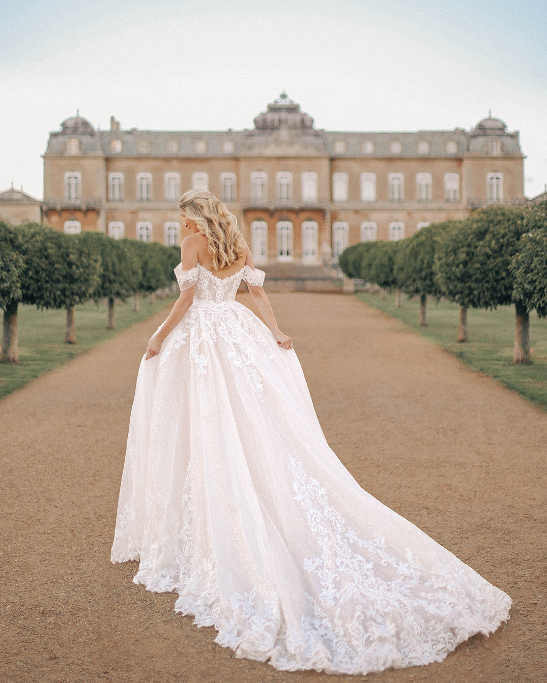 blonde bride in a cindrella inpired bridal gown in france