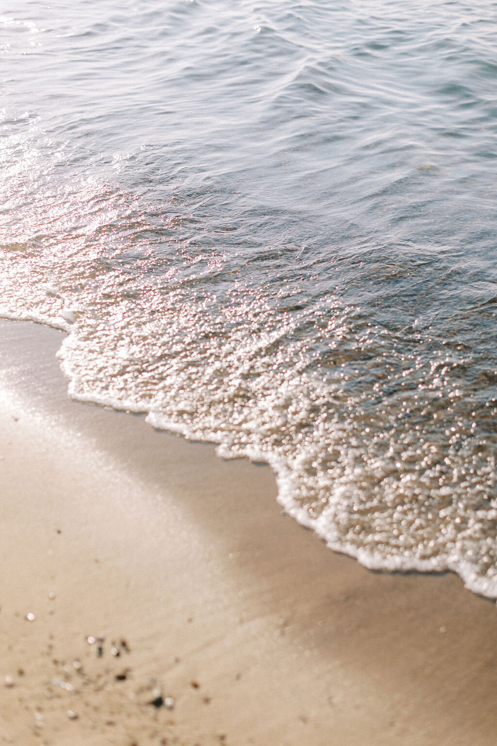 Wave crashing on the shore to show chicago wedding photography by Allison Francois Photography