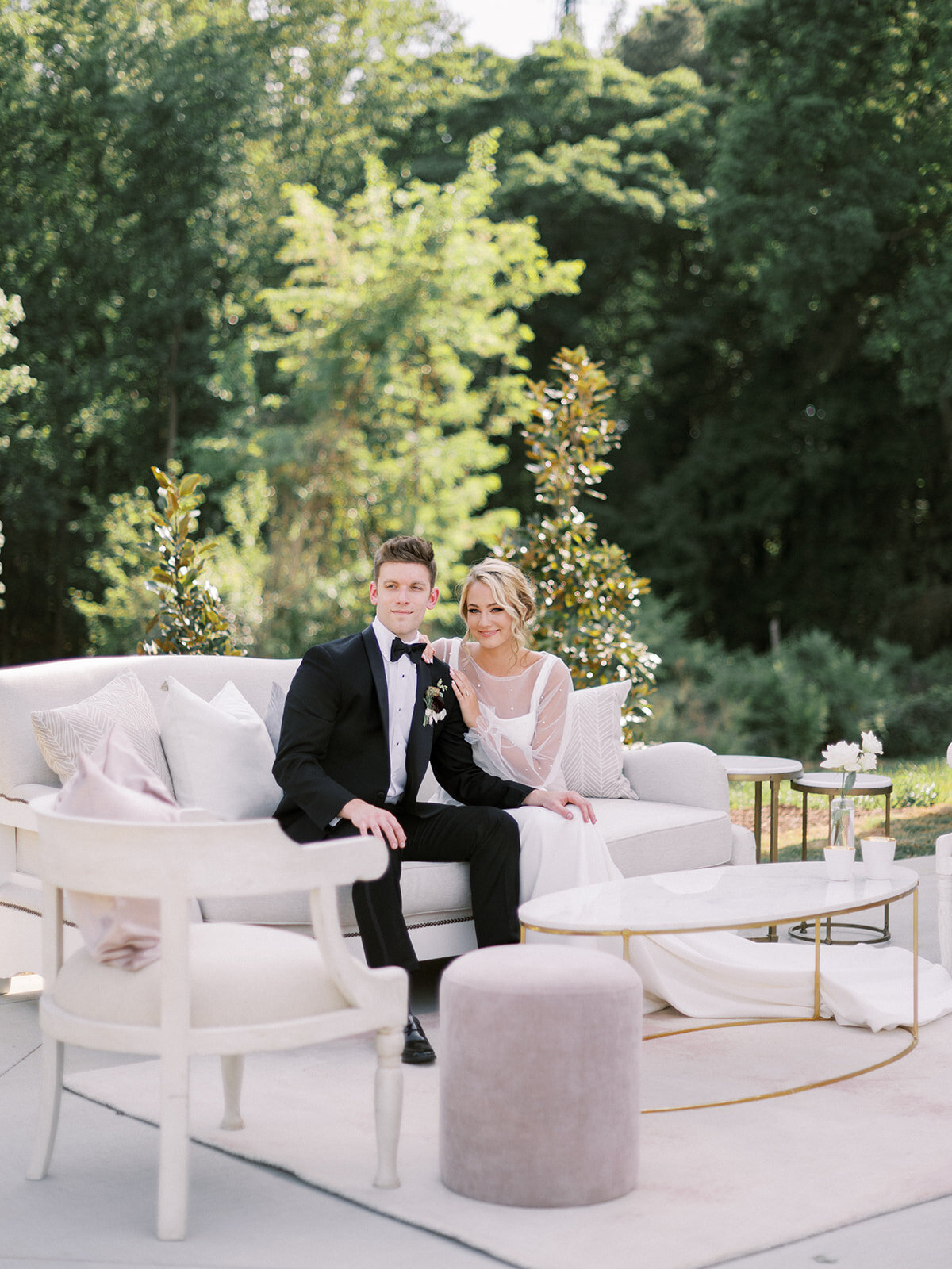 couple seated on a cottage luxe lounge