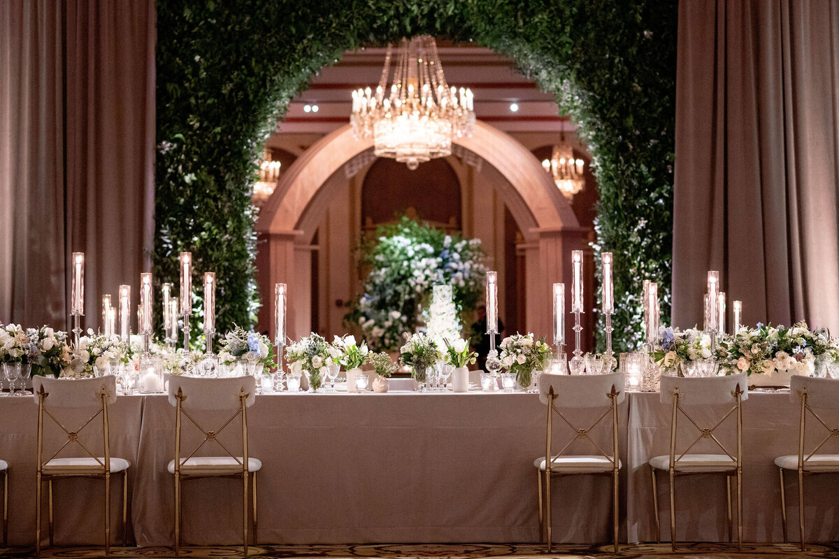 A picture of the decorated table at the wedding reception.