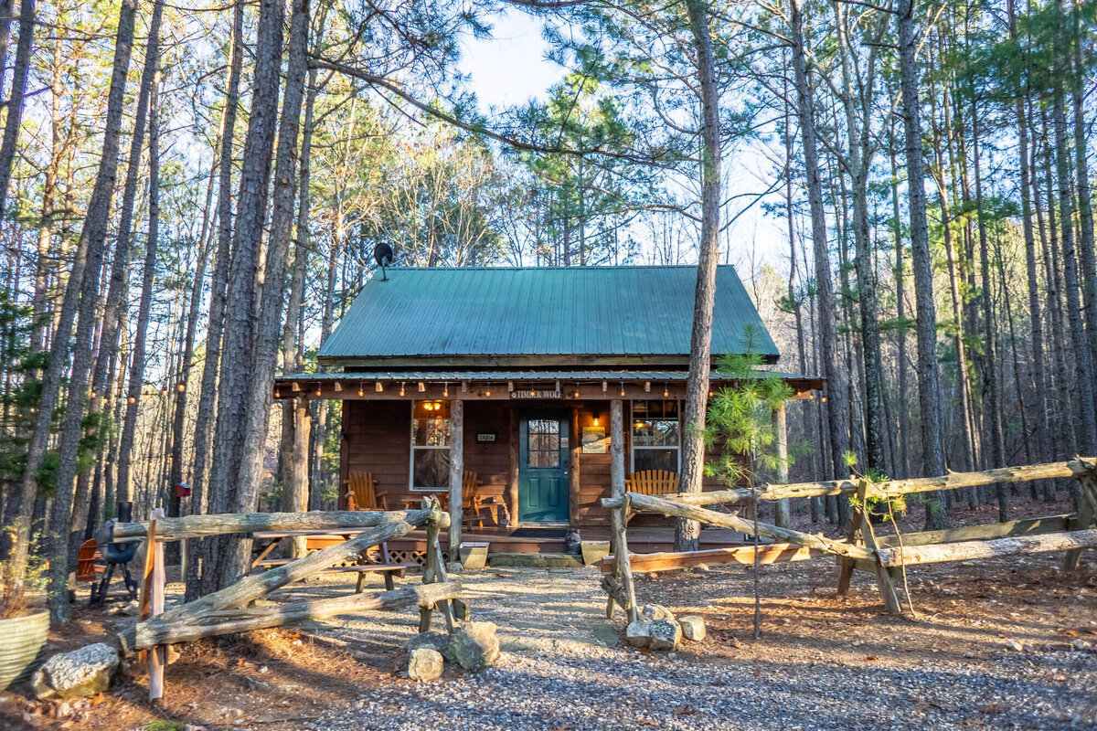 Beautiful cabin with green metal roof in the Ouachita mountains