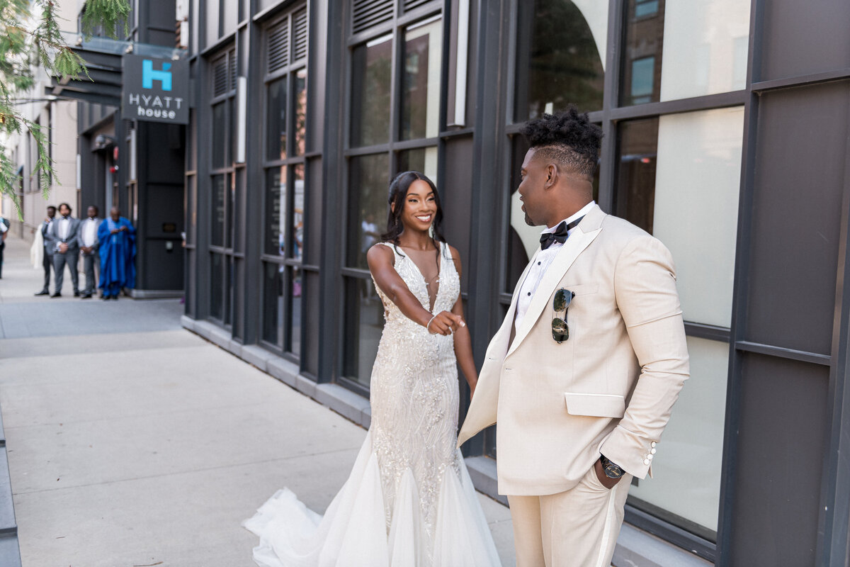 Bride and groom leaving wedding in decorated car