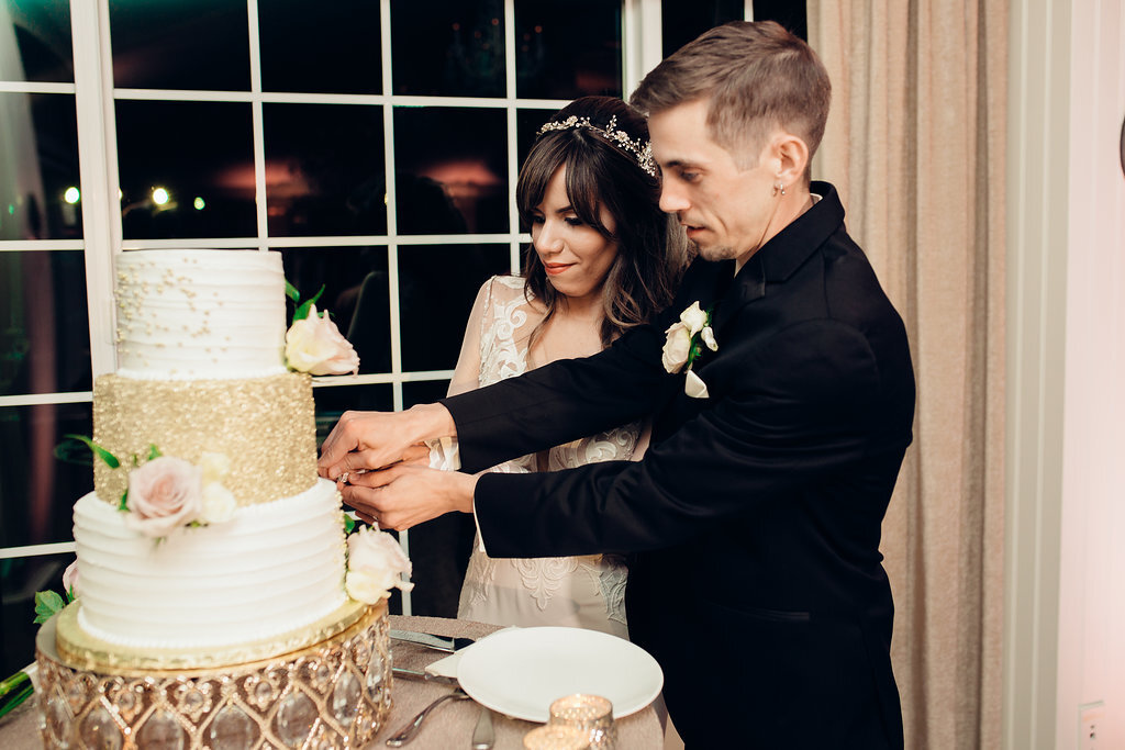 Wedding Photograph Of Bride And Groom Cutting The Cake Los Angeles