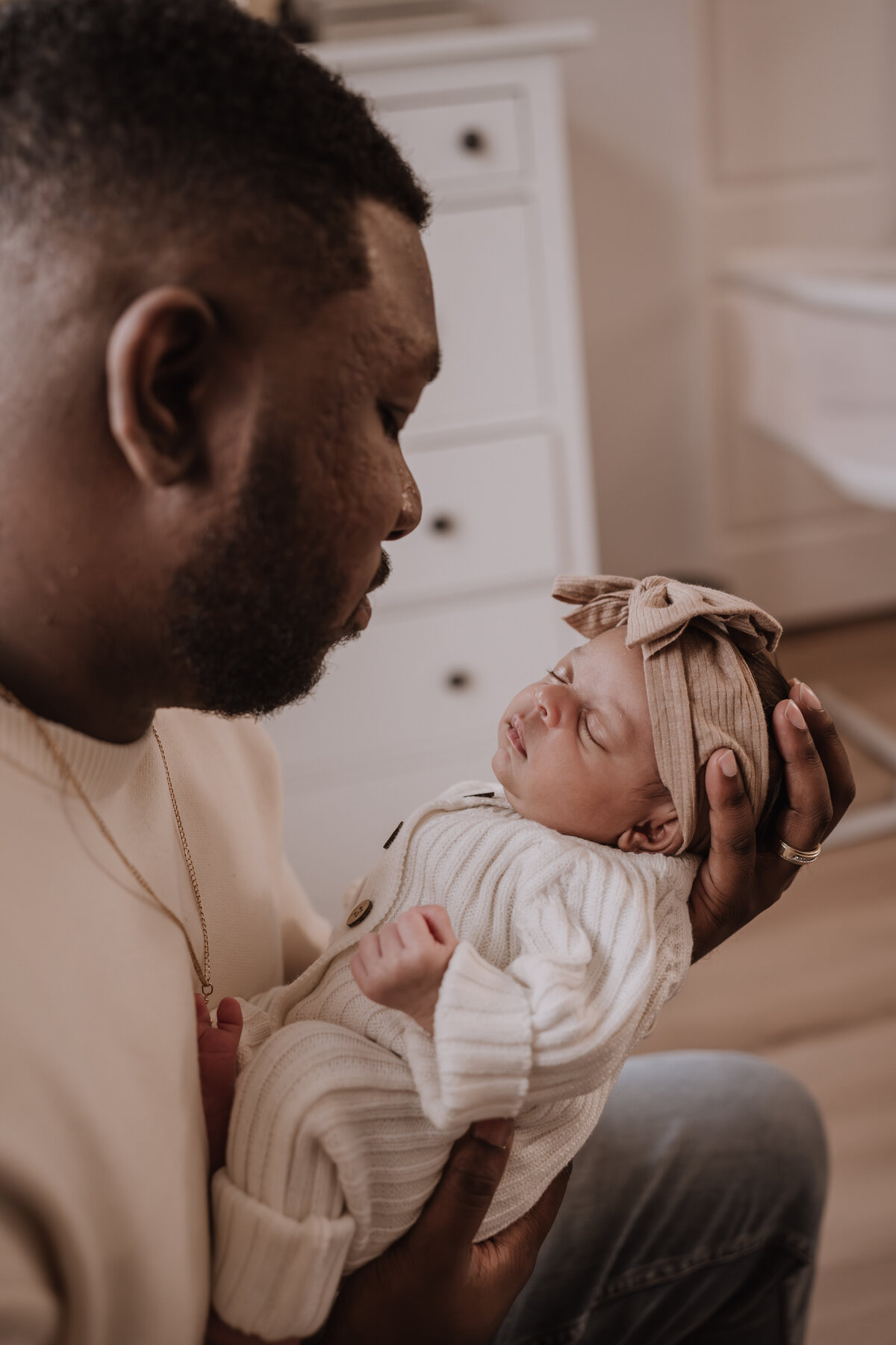 dad holding baby girl