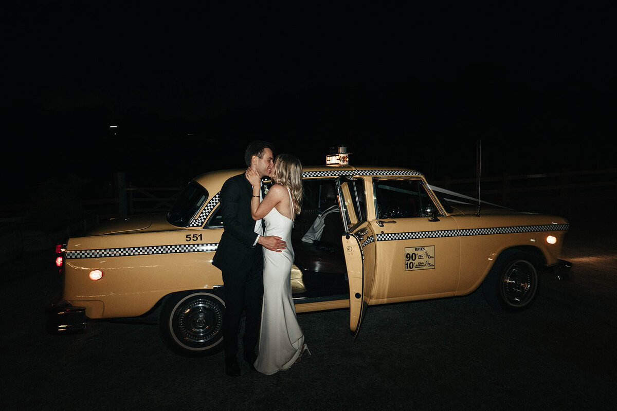 bride and groom sharing a kiss just before leaving for Melbourne after their Yarra Valley Wedding