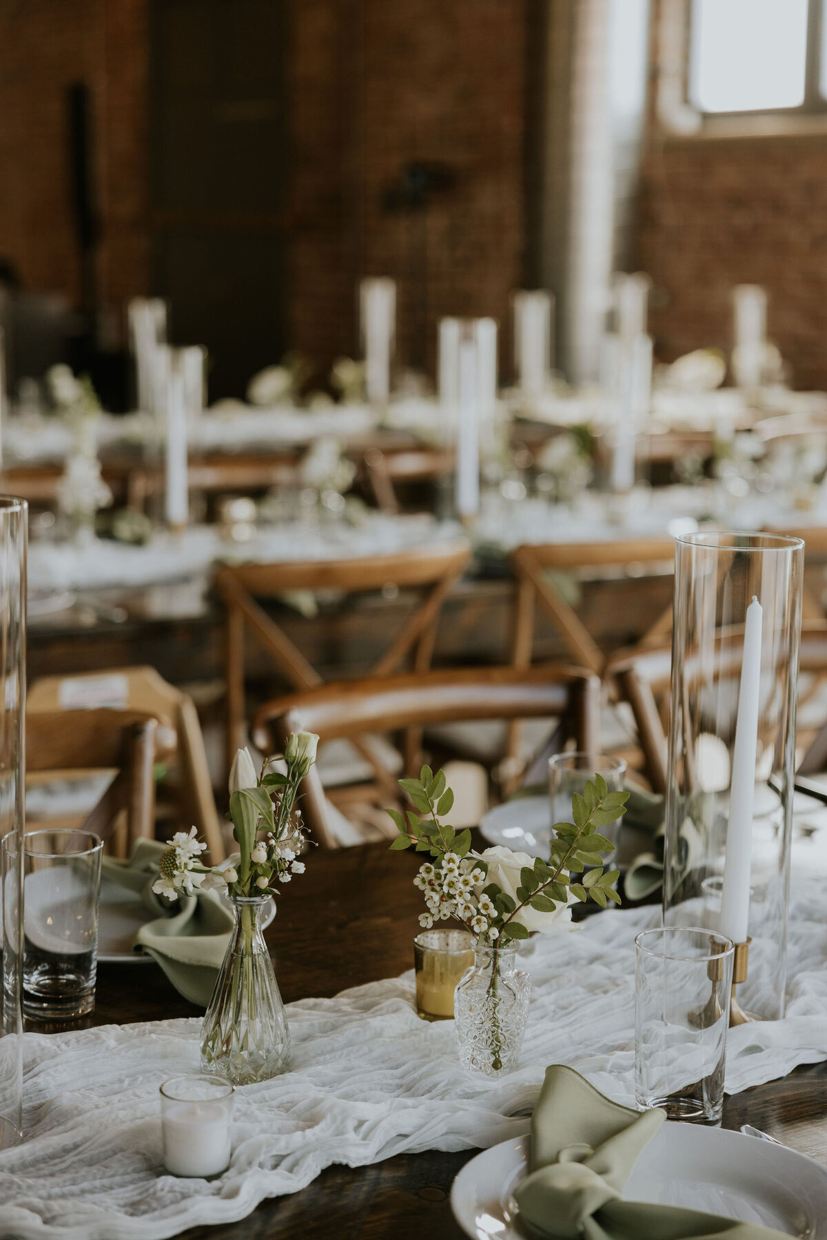 Wedding tablescape at greenery and white wedding at the St Vrain, Longmont wedding venue
