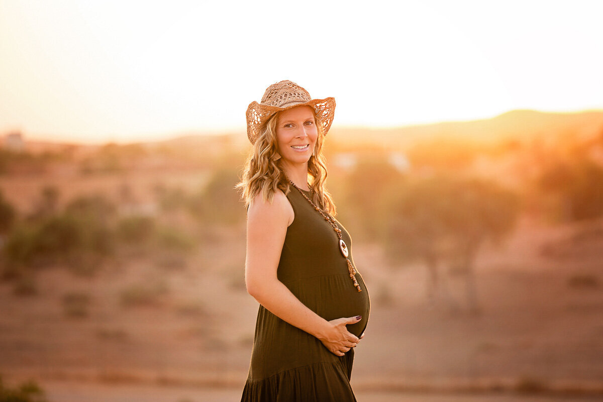 Pregnancy sunset photo shoot in desert by Yuliia Terziian Photography