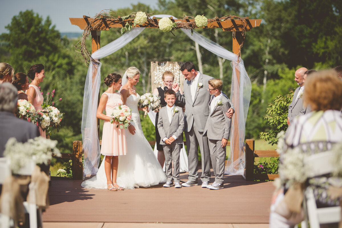 Family stands during vow renewal ceremony