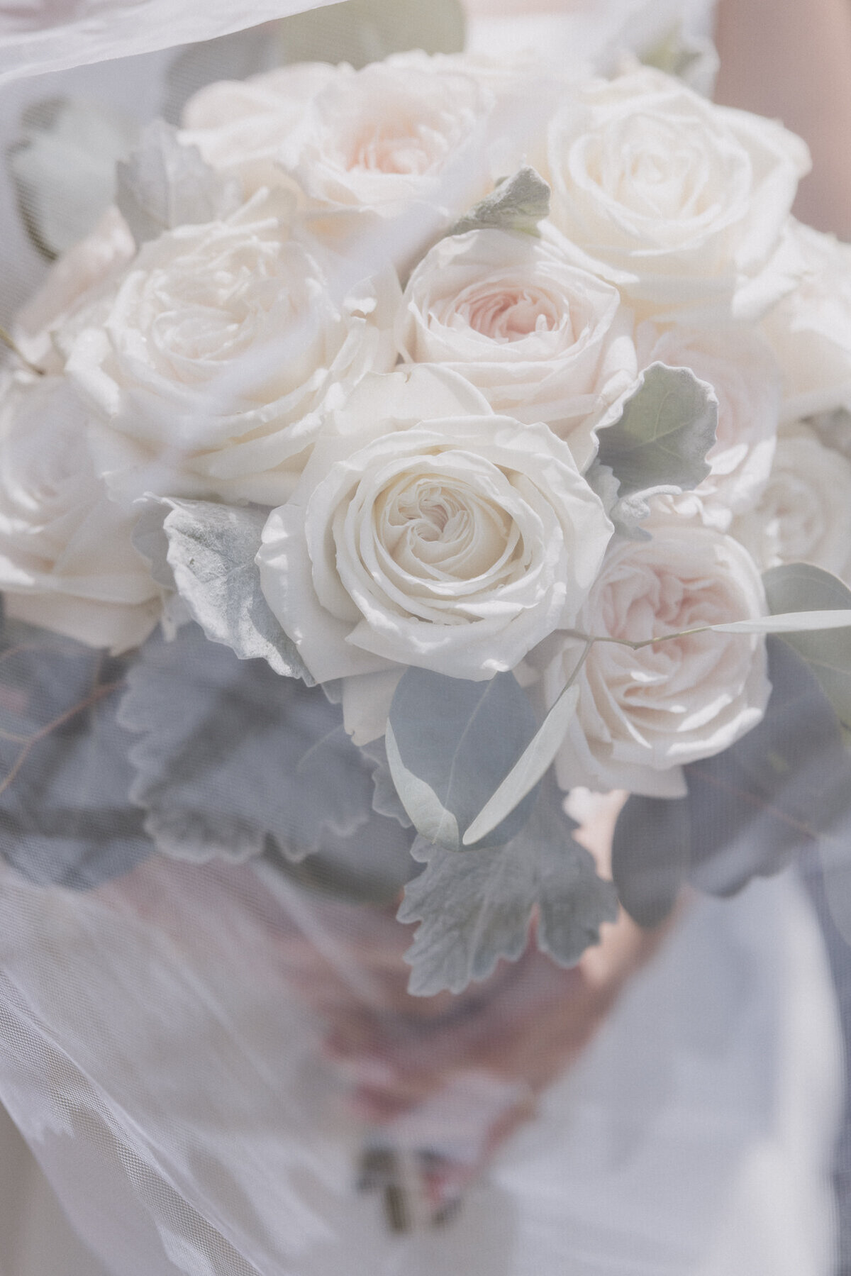 bridal bouquet under the veil