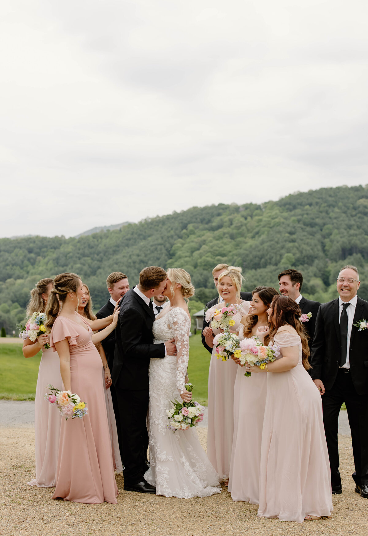 Bridal party with colorful bouquets designed by Abby Grace Florals at NC wedding