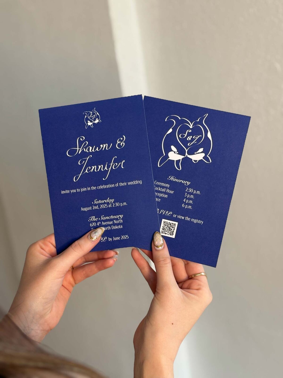 Custom calligraphy wedding design on blue invitation