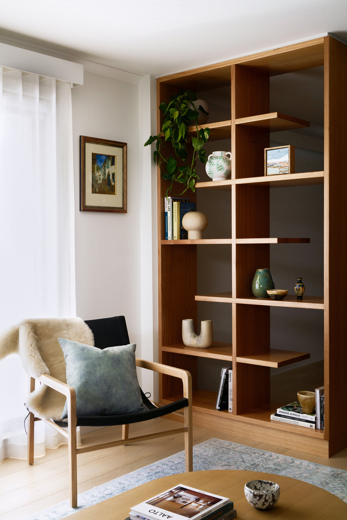 Wooden bookshelf with ornaments styling