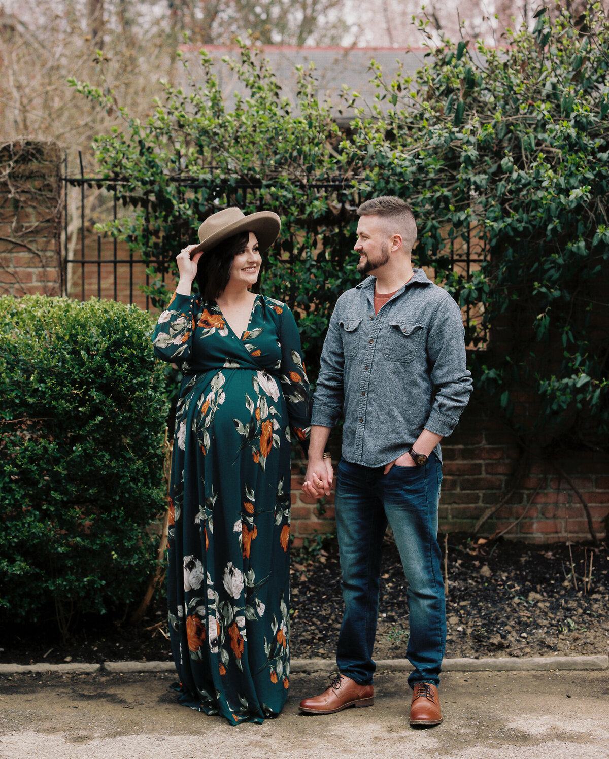 Couple stares lovingly at each other during maternity shoot