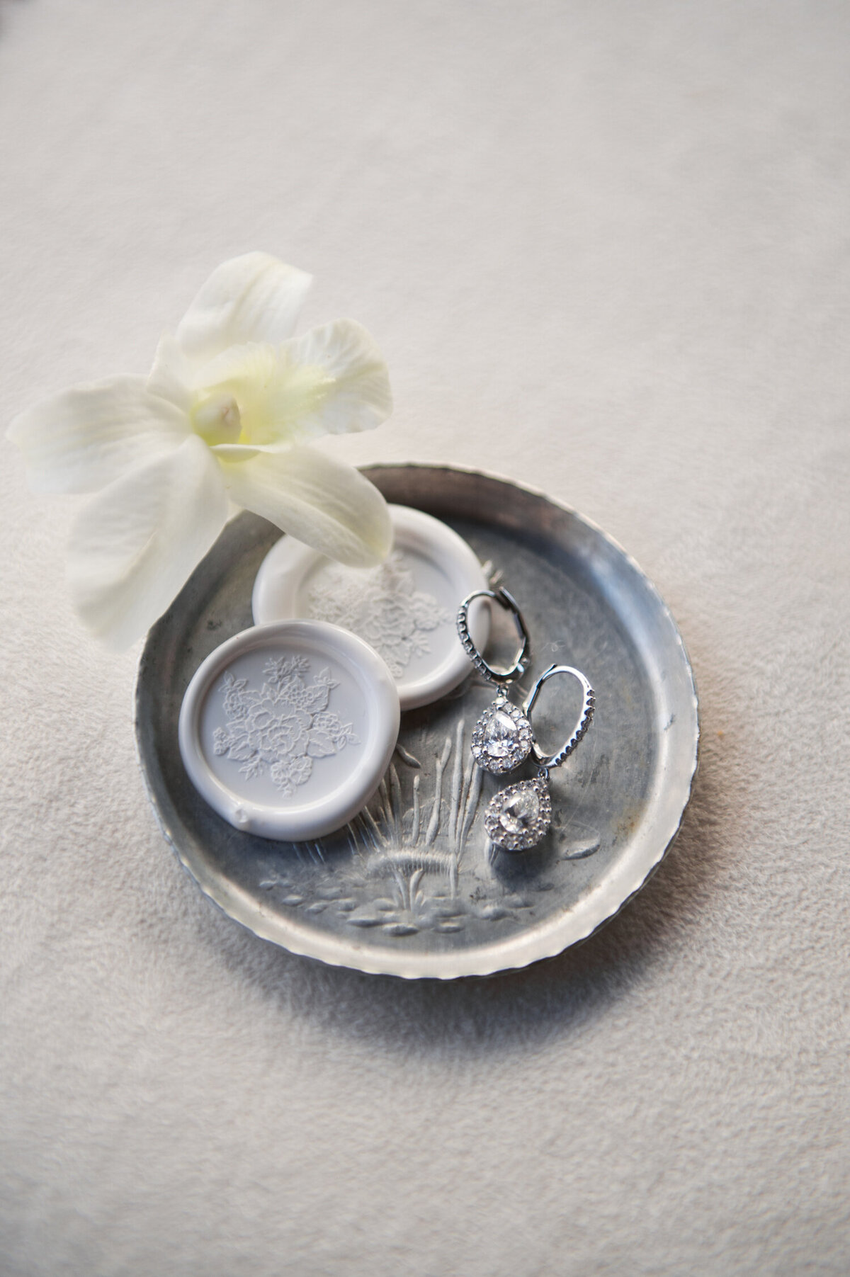 tiffany earrings displayed on silver plate at chateau de lis