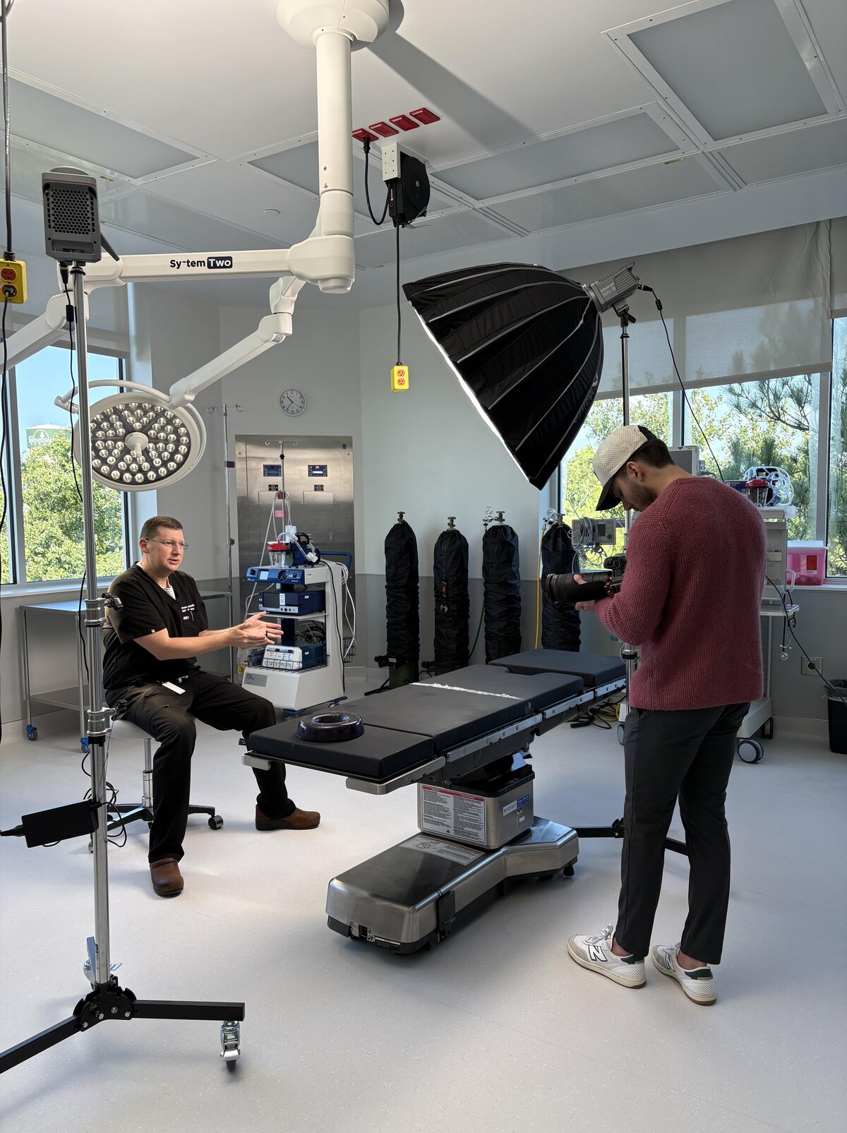 Luma Media crew setting up lights for a shoot inside an operating room