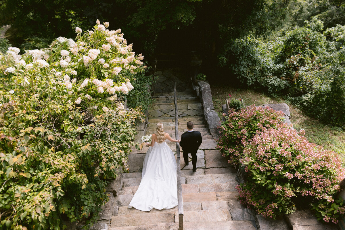 5-bride-and-groom-descending-stairs-upstate-new-york-weddings