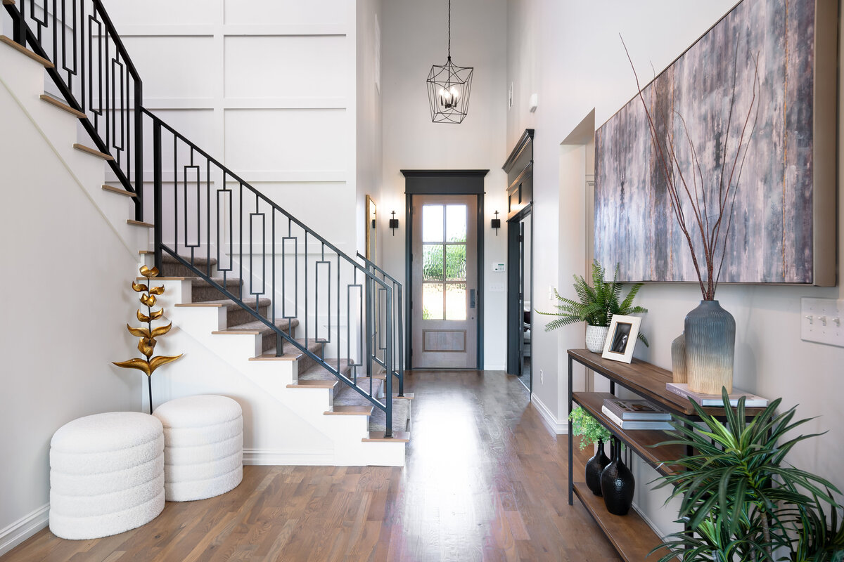Tulsa home Iron Stairs entry way Boulevard interiors Gunta Sandmeyer
