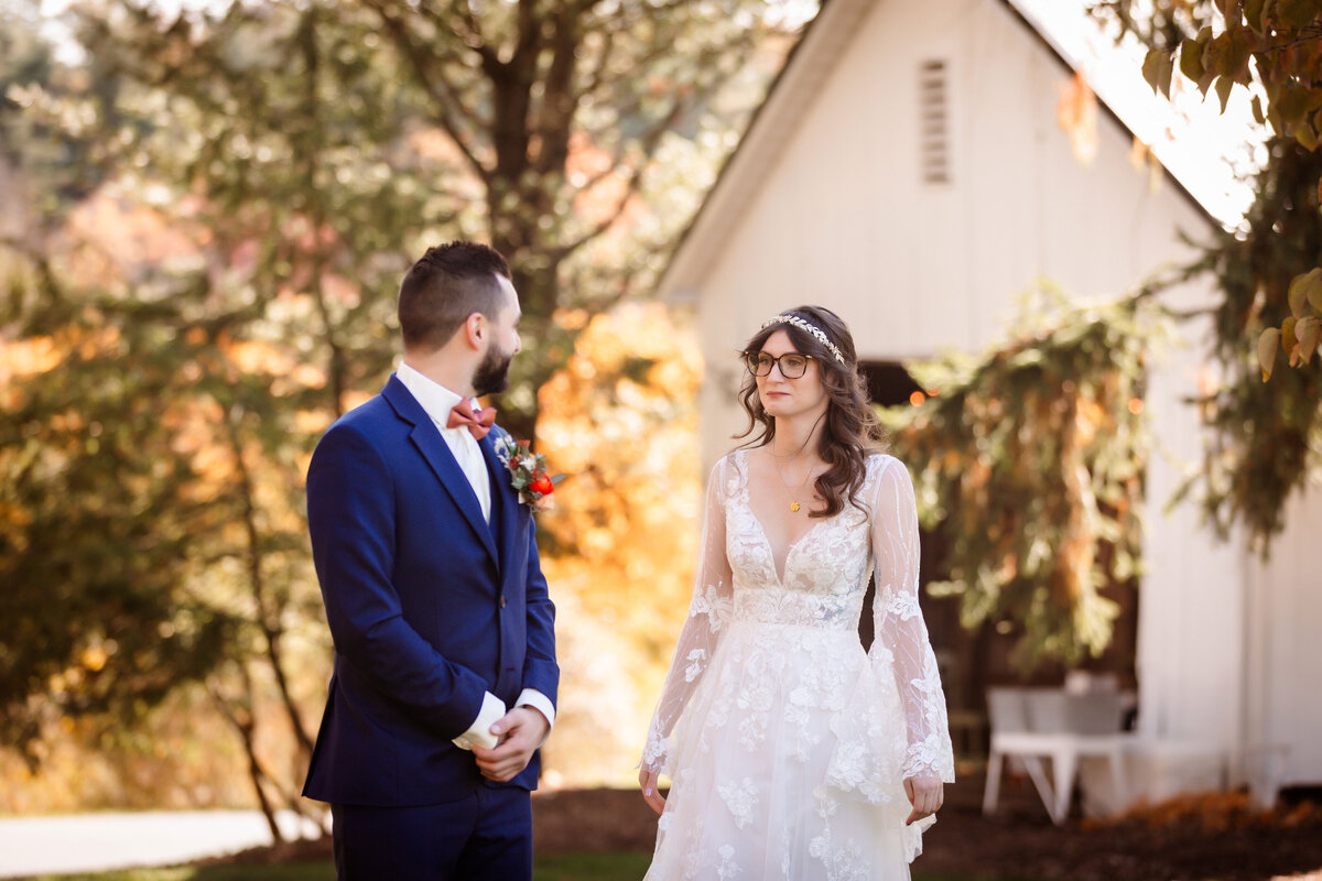 bride and groom seeing each other for their first look at shady elms farm