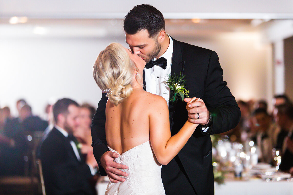 couple kissing during their first dance wedding reception