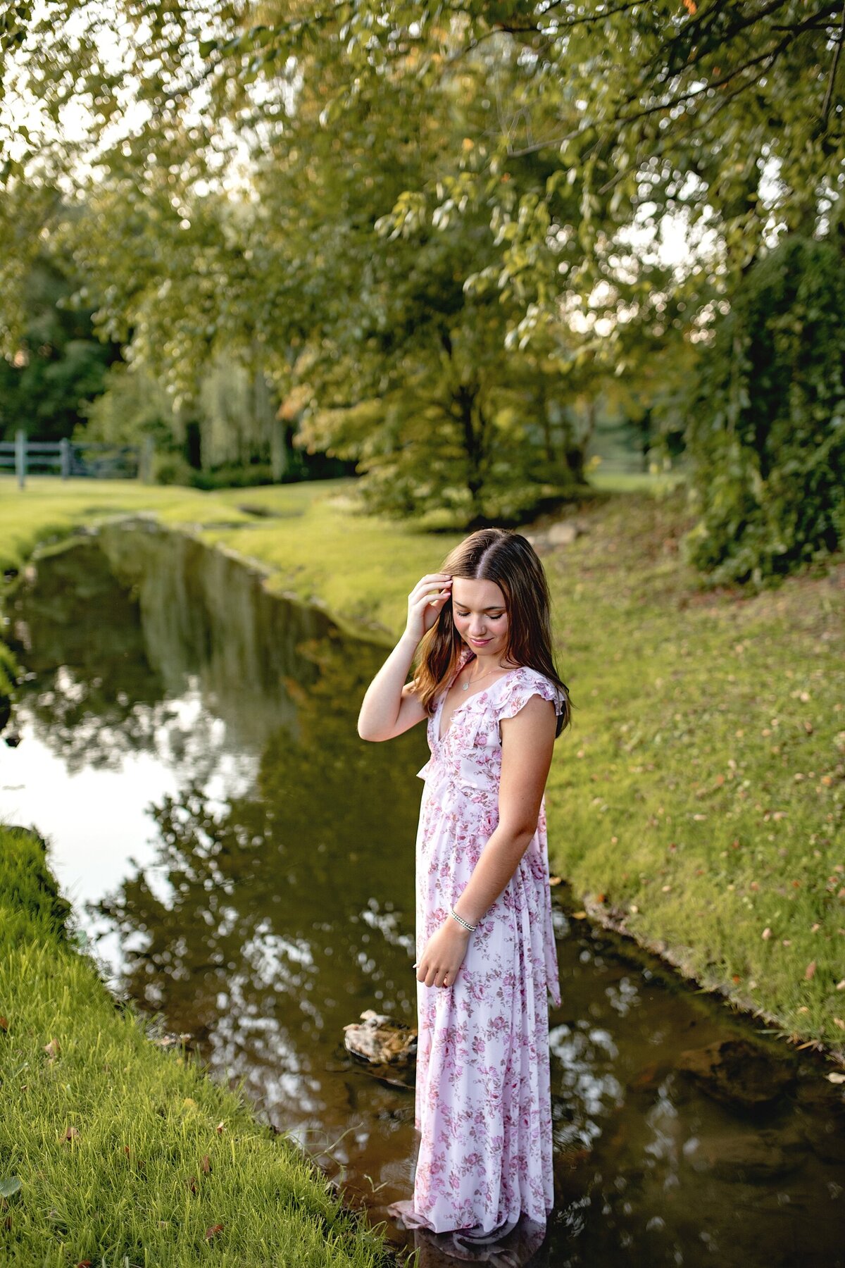 senior-girl-standing-in-creek