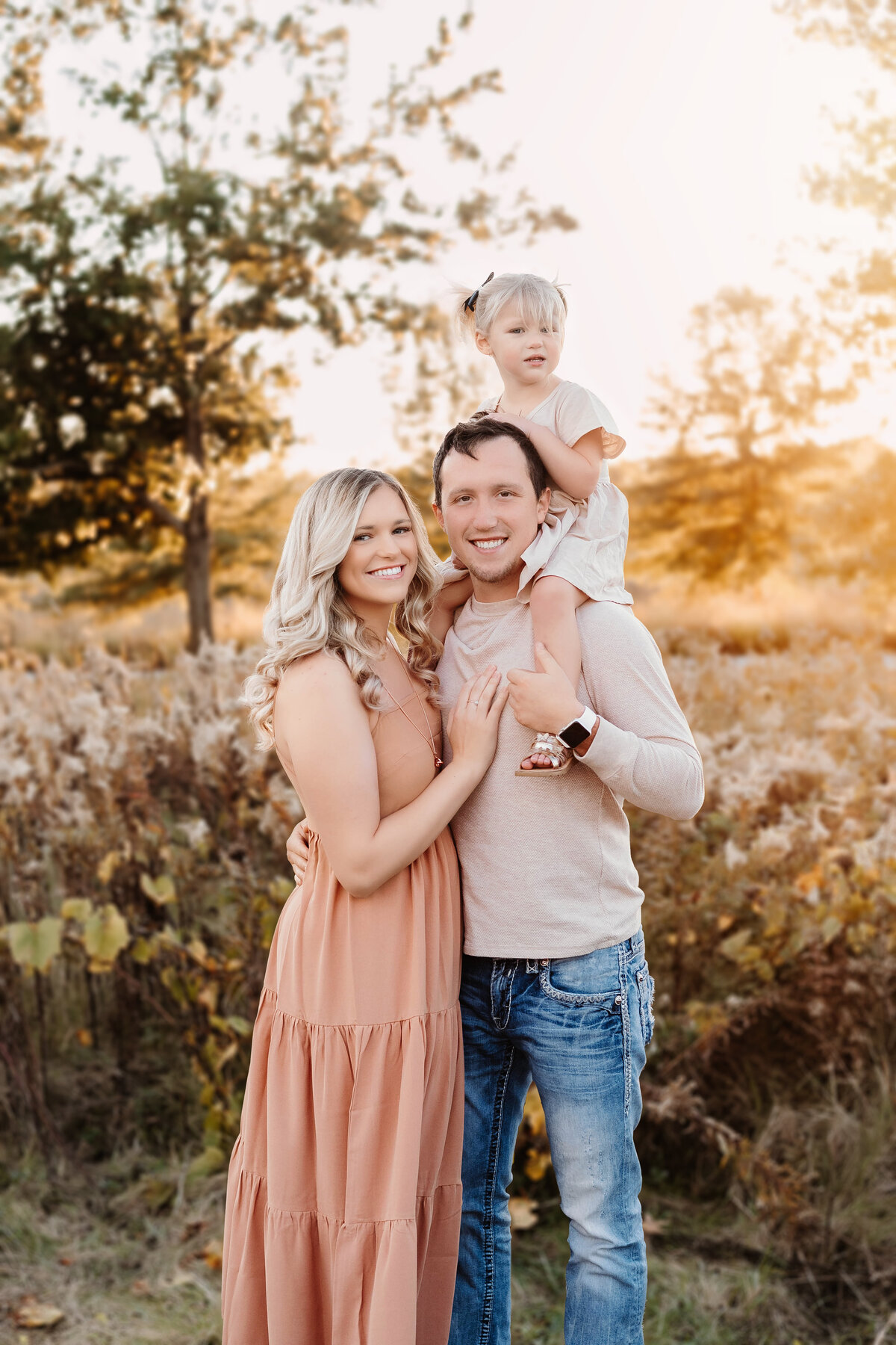 This family poses for a fall mini session.