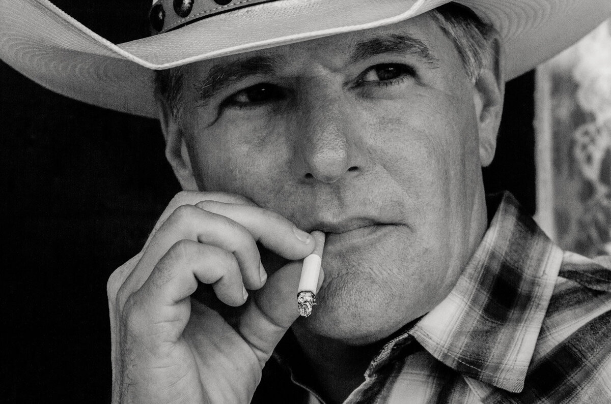 Country Music Portrait black and white closeup Darrell Goldman smoking cigarette wearing white cowboy hat