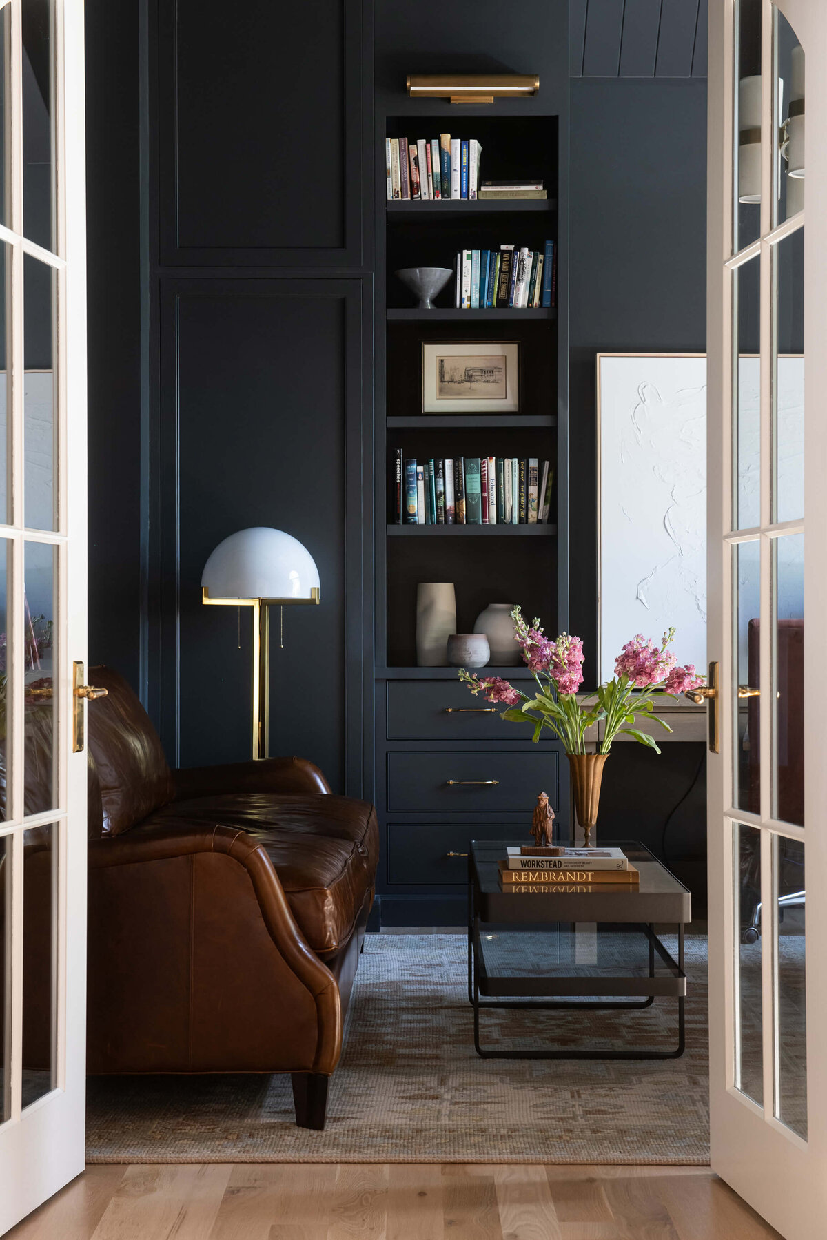 english-tudor-home-library-dark-paneling-leather-chair