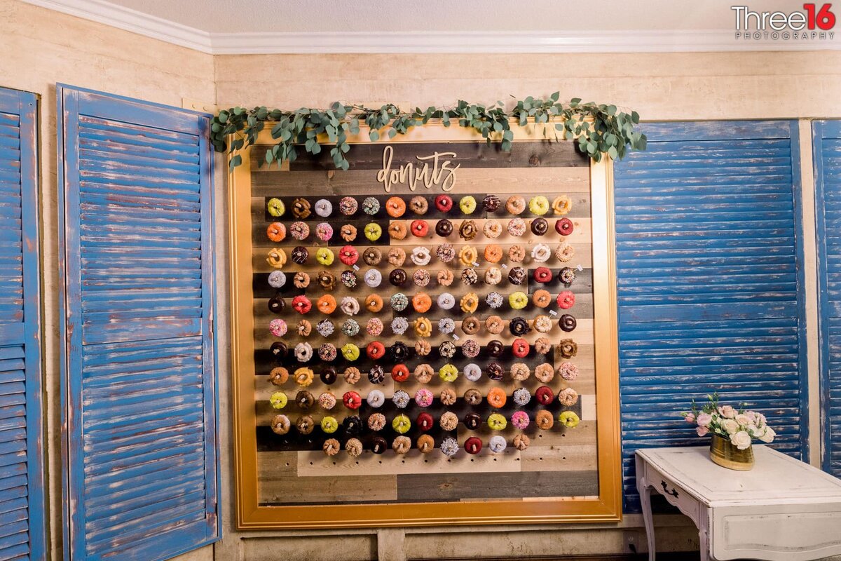 Donut Wall offered at a wedding reception