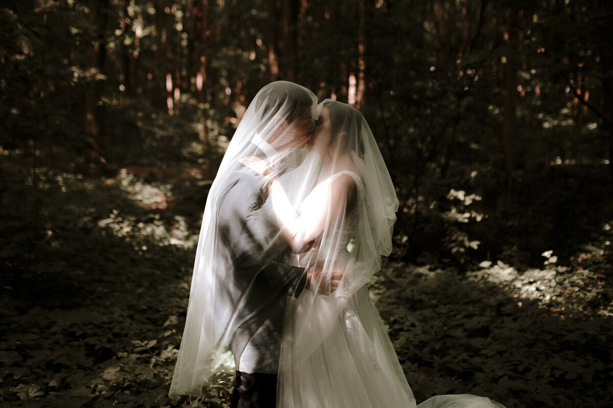 bride and groom in the forest creative portrait