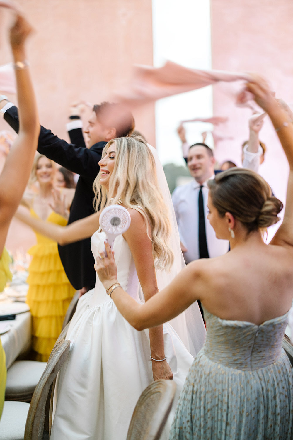 candid photo of bride and groom entering wedding reception at neuendorf house