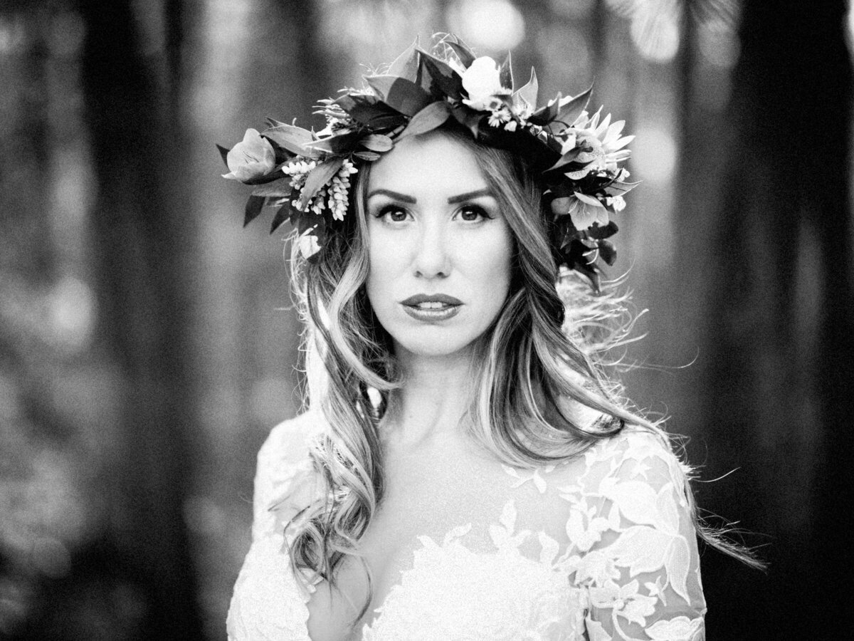 A woman in a wedding dress and flower crown