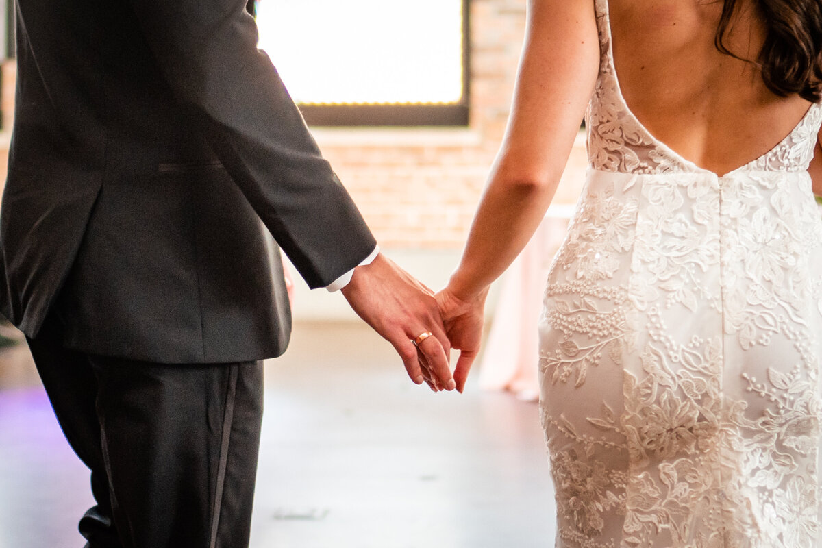 bride-groom-holding-hands