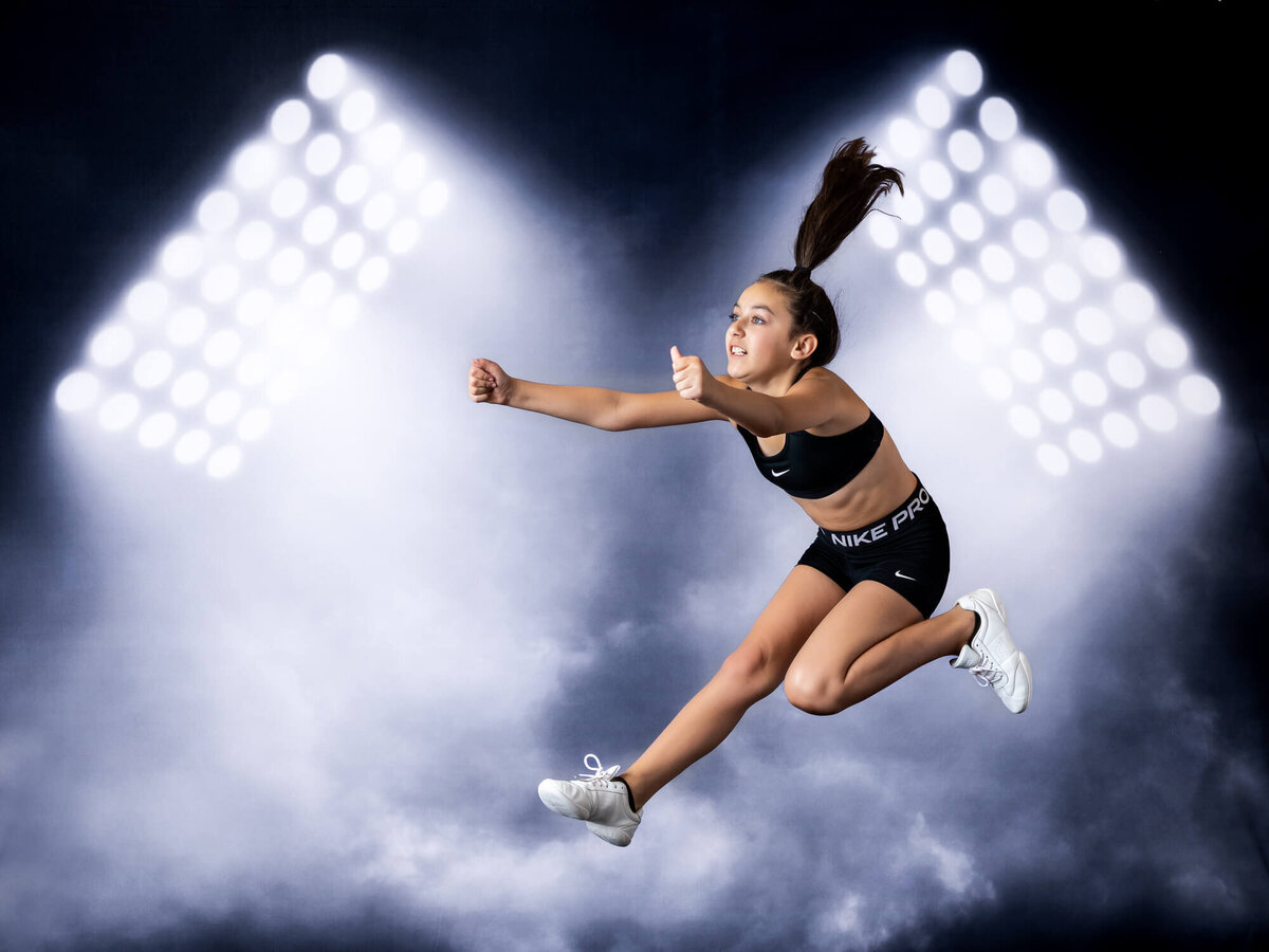 Prescott gymnastics athlete jumps through the air in sports portrait by Prescott kids photography by Melissa Byrne